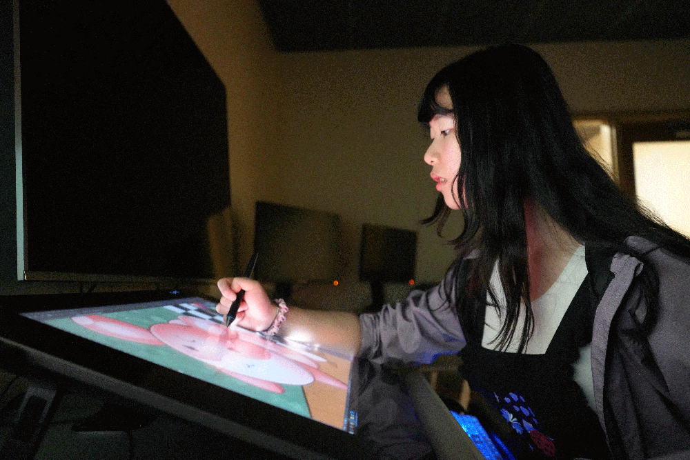 Amy Ni designs a hamster using a Media School animation tablet.